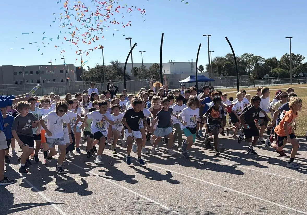 Pine View students surging off the start line at Peramathon as confetti falls