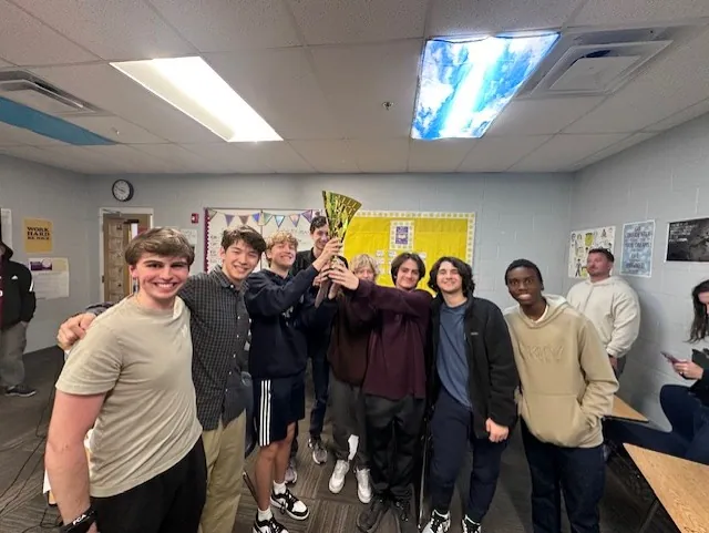 Quiz Bowl team with their trophy