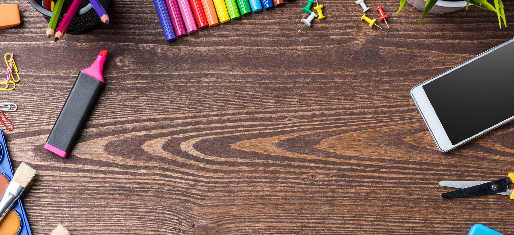 School supplies displayed atop a wood table